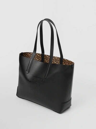 Shop Burberry Embossed Monogram Motif Leather Tote In Black