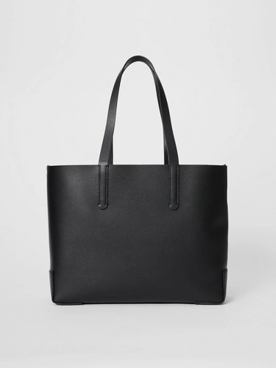 Shop Burberry Embossed Monogram Motif Leather Tote In Black