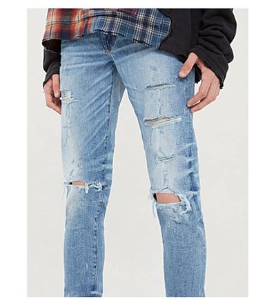 Shop Amiri Thrasher Skinny Jeans In Rough