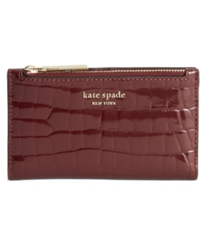 Shop Kate Spade Sylvia Croc Embossed Slim Bifold Leather Wallet In Cherrywood/gold