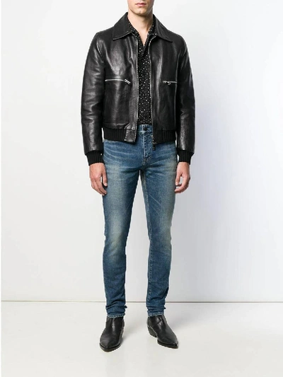 Shop Saint Laurent Faded Mid-rise Slim Jeans