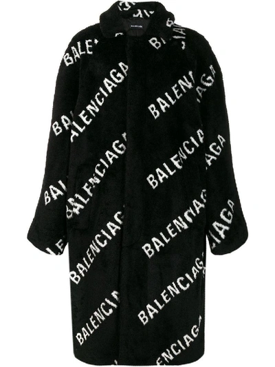 Shop Balenciaga All Over Logo Coat In Black