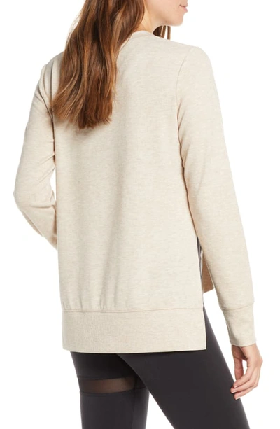 Shop Alo Yoga 'glimpse' Long Sleeve Top In Putty Heather