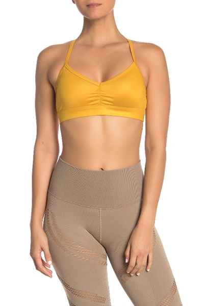 Shop Alo Yoga Sunny Strappy Yoga Bra In Tuscan Sun Glossy