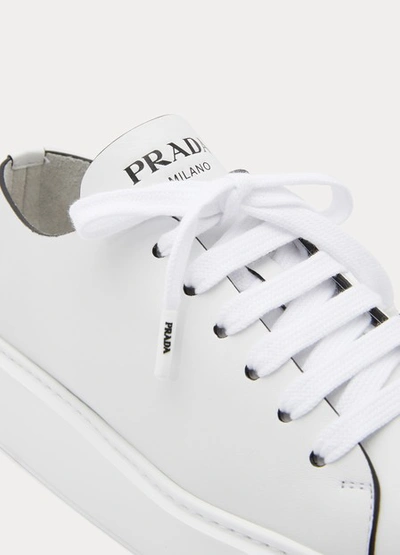 Shop Prada Wedge Sneakers In White