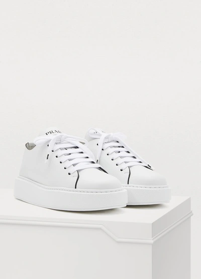 Shop Prada Wedge Sneakers In White