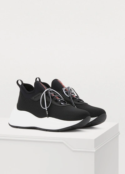 Shop Prada Low-top Sneakers In Nero/bianco