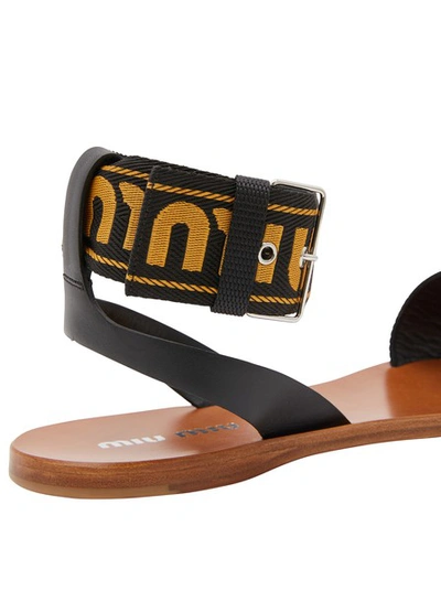 Shop Miu Miu Logo Sandals In Kaki+nero