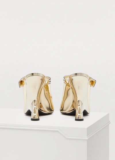 Shop Prada High-heeled Mules In Gold