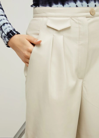 Shop Nanushka Mitsu Vegan Leather Trousers In Crème