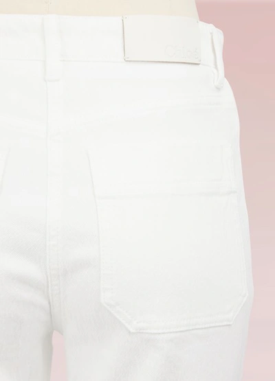 Shop Chloé Lace-up Cropped Jeans In White