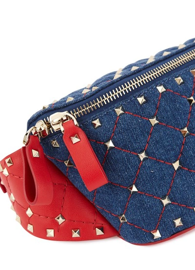 Shop Valentino Garavani Rockstud Belt-bag In Light Denim/rouge Pur
