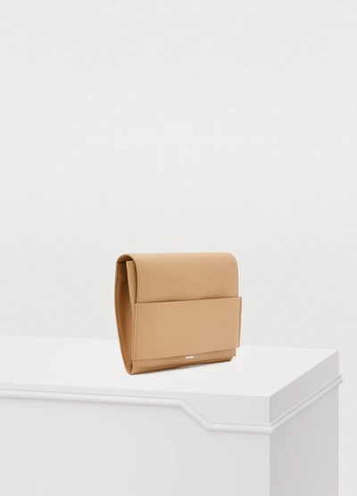 Shop Jil Sander Leather Clutch In 261 - Medium Beige