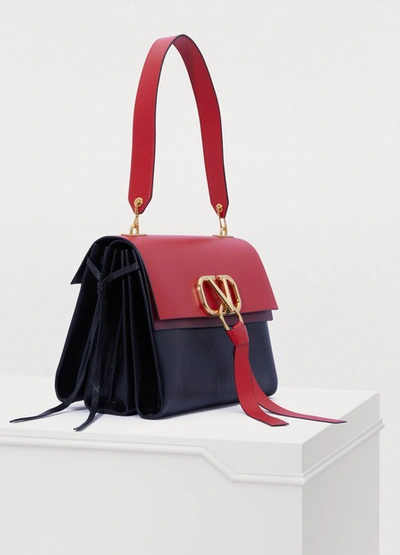 Shop Valentino Garavani Vee Ring Shoulder Bag In Rouge Pure/ Cerise/ Black