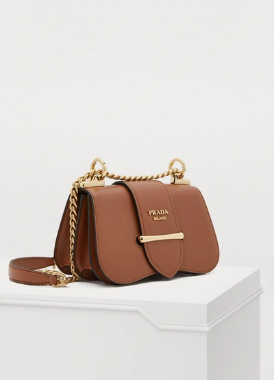 Shop Prada Sidonie Crossbody Bag In Cognac