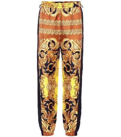 Shop Versace Printed Silk Pants In Yellow