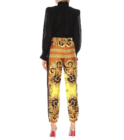 Shop Versace Printed Silk Pants In Yellow