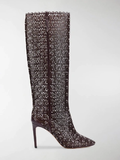 Shop Alaïa Knee High Studded Boots In Red