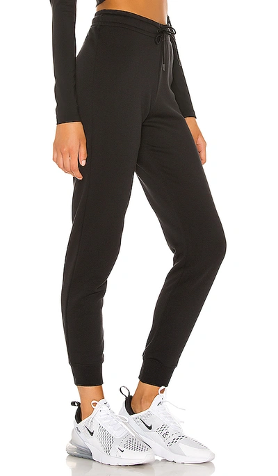 Shop Nike Nsw Essential Tight Fleece Pant In Black.