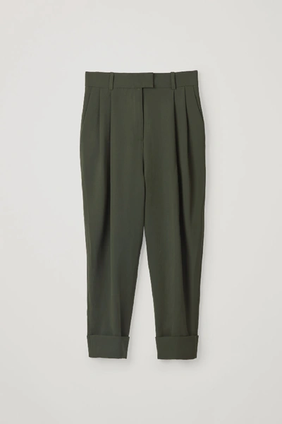 Shop Cos Dropped Crotch Trousers With Pleats In Green