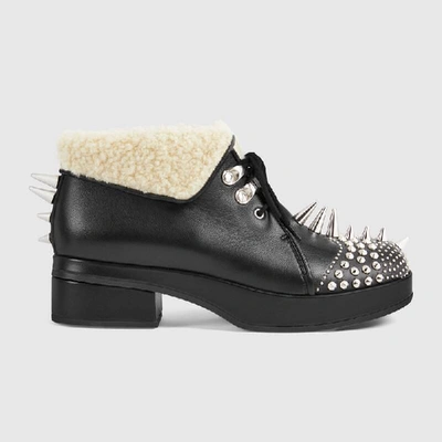 Shop Gucci Leather Bootie With Spikes And Studs In Black