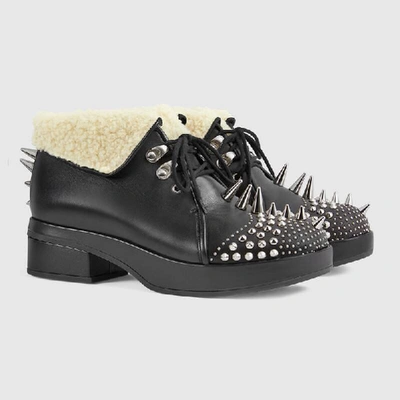 Shop Gucci Leather Bootie With Spikes And Studs In Black