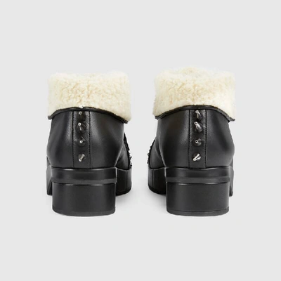 Shop Gucci Leather Bootie With Spikes And Studs In Black