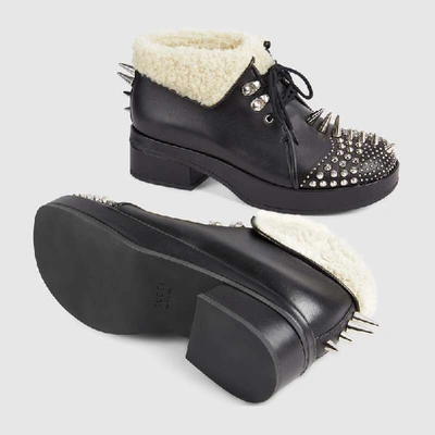 Shop Gucci Leather Bootie With Spikes And Studs In Black