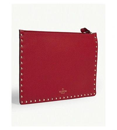 Shop Valentino Leather Rockstud Pouch Bag In Rouge Pur