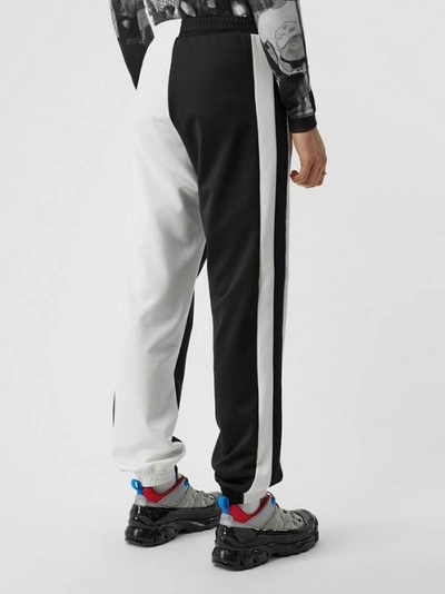 Shop Burberry Logo Graphic Two-tone Jersey Trackpants In Black