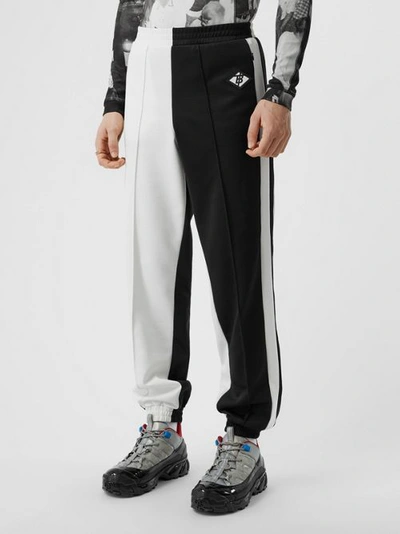 Shop Burberry Logo Graphic Two-tone Jersey Trackpants In Black