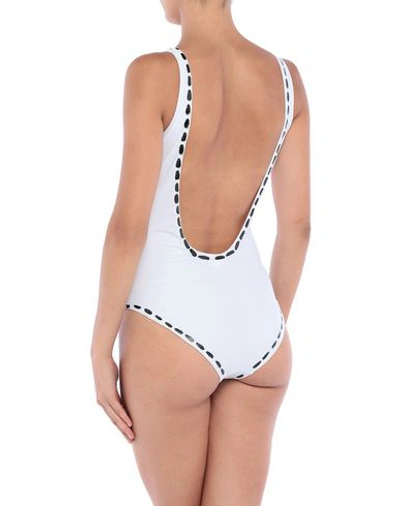 Shop Moschino One-piece Swimsuits In White