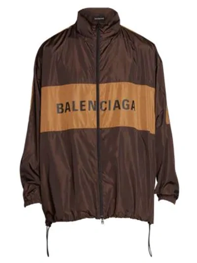 Shop Balenciaga Oversized Logo Windbreaker Jacket In Dark Brown