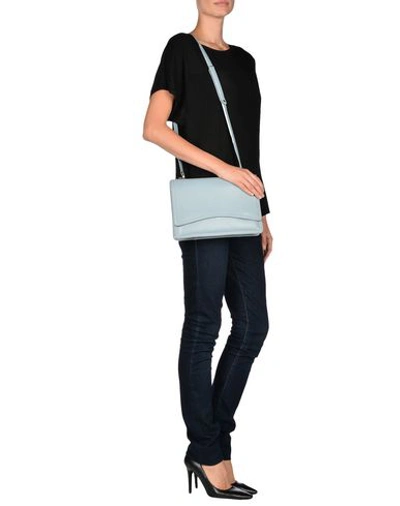 Shop Maison Margiela Cross-body Bags In Sky Blue