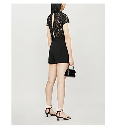 Shop Maje Ilo Ruffled-trim Lace-panelled Crepe Playsuit In Black