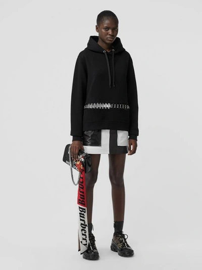 Shop Burberry Ring-pierced Cotton Oversized Hoodie In Black