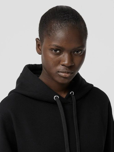 Shop Burberry Ring-pierced Cotton Oversized Hoodie In Black