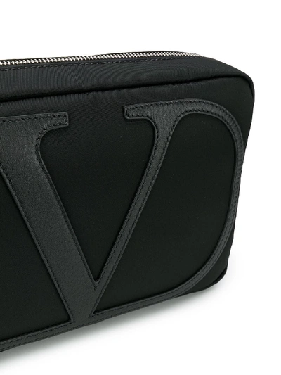 Shop Valentino Logo Printed Cross Body Bag In Black