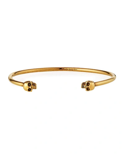 Shop Alexander Mcqueen Men's Thin Twin Skulls Cuff Bracelet, Golden