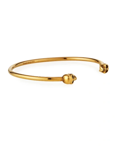 Shop Alexander Mcqueen Men's Thin Twin Skulls Cuff Bracelet, Golden