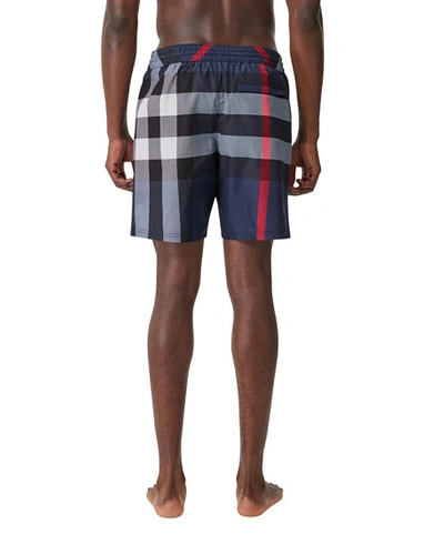 Shop Burberry Men's Guildes Signature Check Swim Trunks In Blue