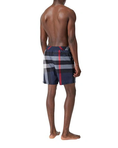 Shop Burberry Men's Guildes Signature Check Swim Trunks In Blue