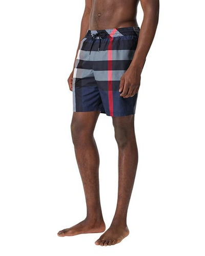 Shop Burberry Men's Guildes Signature Check Swim Trunks In Blue