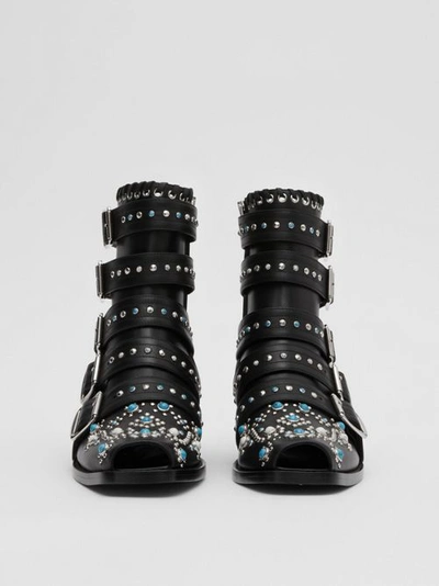 Shop Burberry Buckled Embellished Leather Peep-toe Ankle Boots In Black