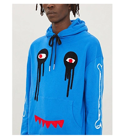 Shop Haculla Graphic-print Cotton-jersey Hoody In Blue