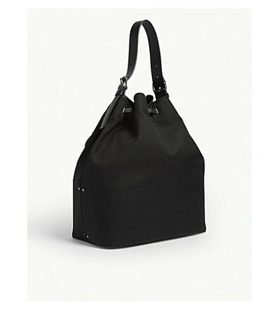 Shop Valentino X Undercover Skull Patch Nylon Bucket Bag In Black