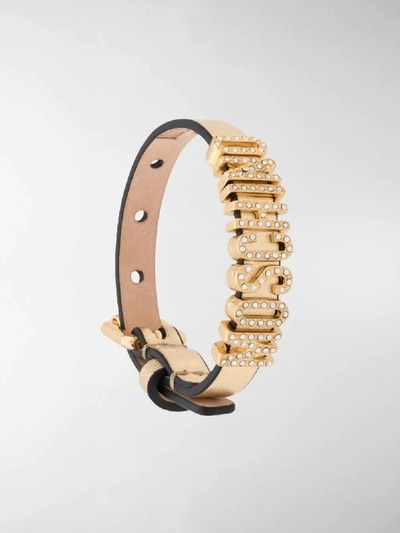 Shop Moschino Crystal-embellished Logo Bracelet In Gold