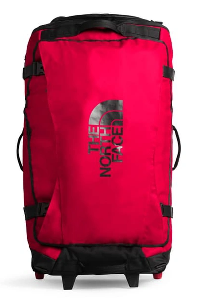 Shop The North Face Rolling Thunder Wheeled Duffle Bag In Tnf Red/ Tnf Black