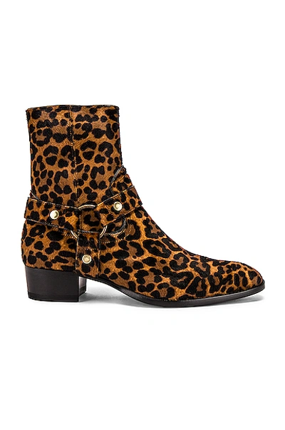 Shop Saint Laurent Wyatt Pony Hair Harness Boots In Natual In Animal Print,brown In Natural