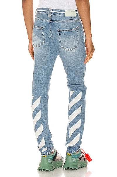 Shop Off-white Diagonal Stripe Slim Jeans In Bleach White